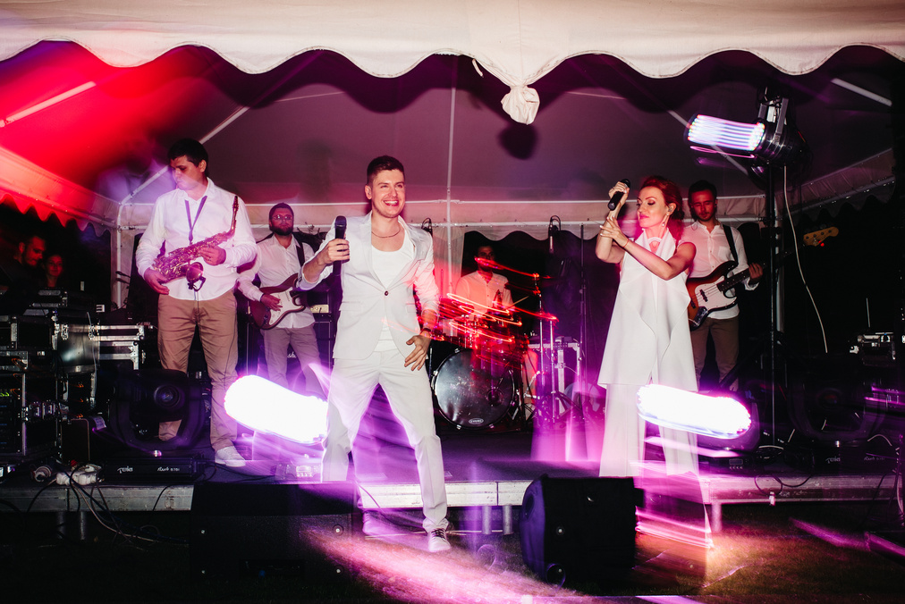 a band on stage at a wedding
